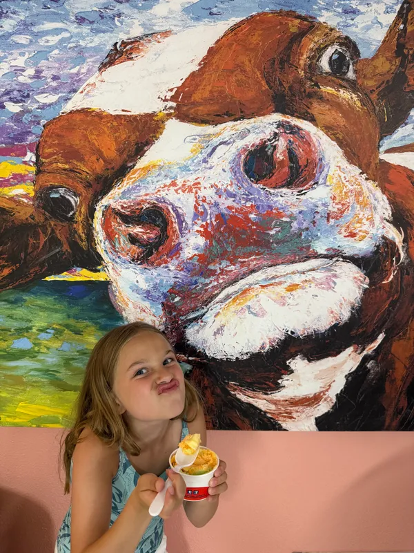 We are in Perdido Key, Florida and across from our family condo is our favorite ice cream shop, Hershey’s. Margaret always poses for a picture with her fav cow while enjoying her rainbow sherbet!