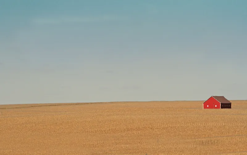 Solitude: Taken a few years ago while on a road trip in Wisconsin. We stopped the car because the red barn against the color of the field and the almost cloudless sky at dusk was beautiful. (Ellen Prather-Illinois)