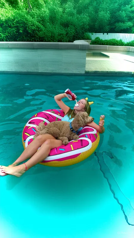 I turned total chaos into the ultimate ice cream moment! I stuck two cones on my head, held another in my hand, balanced on a floaty, and somehow juggled a dog too.. all at the same time! This photo is bright, bold, wild, and definitely messy!!!